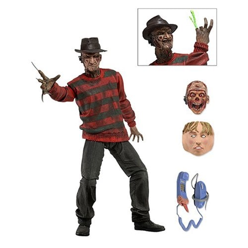Action figure of a character in a red and green striped sweater with accessories on a white background