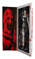Action figure in a box with a red and black design on the left side