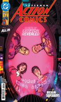 Comic book cover of Action Comics featuring Superman and other characters with a pink background.