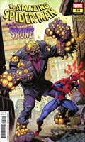 Comic book cover featuring Spider-Man facing off against a giant spider-like creature.