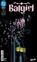 Comic book cover for Batgirl issue 22, featuring the Batgirl character in a black cowl and cape with glowing blue eyes and yellow utility belt, surrounded by pink cherry blossoms on a black background. The DC logo is visible in the top left corner.