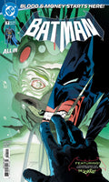 Comic book cover featuring Batman and a green alien-like creature with a red eye.