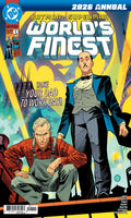 Comic book cover for DC's Batman & Superman 'World's Finest' 2026 Annual, featuring stylized illustrated artwork of two men in suits and overalls against a bright yellow and blue city background.