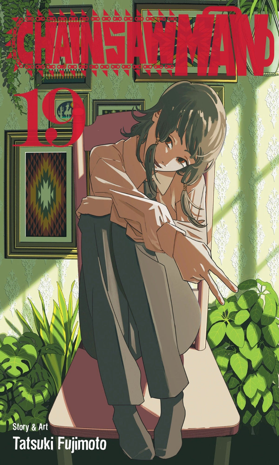 Comic book cover of 'Chainsaw Man' with a character in a chair and greenery.