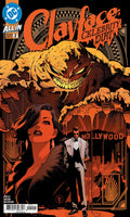 Comic book cover for Clayface: Celebrity Dirt issue 2, featuring a stylized orange and black illustration of Clayface, a woman in a black outfit, and a man in a white suit with a cane, with the DC logo in the top left corner.