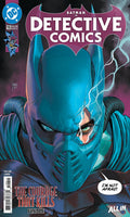 Comic book cover of Detective Comics featuring a superhero in a blue mask with text and DC logo.