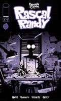 Comic book cover for Exquisite Corpses' Rascal Randy #2, featuring a stylized black-and-purple illustration of a person sitting at a desk in a messy room, with large title text at the top and creator names at the bottom.