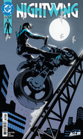 Comic book cover featuring a character on a motorcycle with 'Nightwing' title