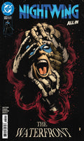 Comic book cover of Nightwing with a stylized face and red hair on a dark background.
