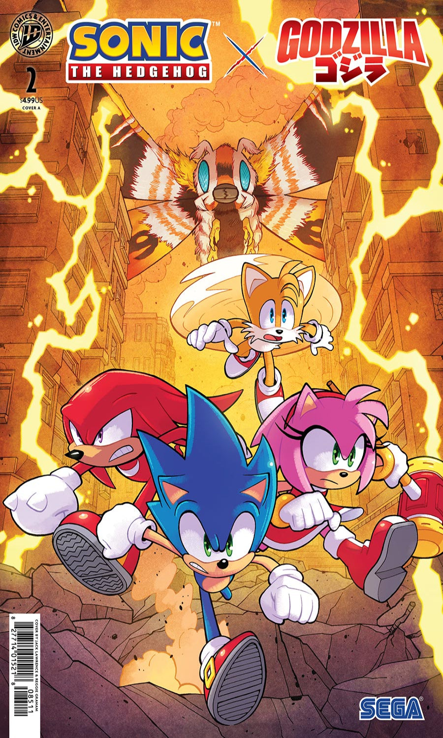 Comic book cover for Sonic the Hedgehog #2 featuring a crossover with Godzilla. Sonic, Tails, Knuckles, and Amy Rose are running through a city street with lightning, with Godzilla and a large bird-like creature flying above.