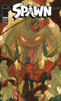 Comic book cover featuring a monstrous creature with glowing eyes and chains, titled 'Spawn'.