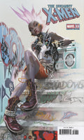 Comic book cover featuring a character from 'The Uncanny X-Men' series on a graffiti-covered wall.