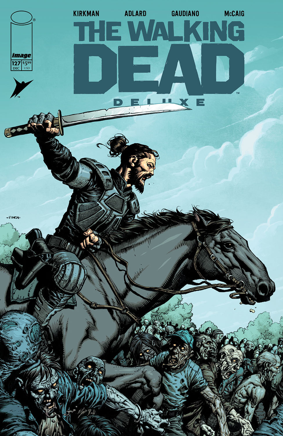 Comic book cover of 'The Walking Dead Deluxe' featuring a character on horseback with a sword, surrounded by zombies.