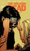 Comic book cover of 'The Walking Dead' with a close-up of two characters on a beige background.