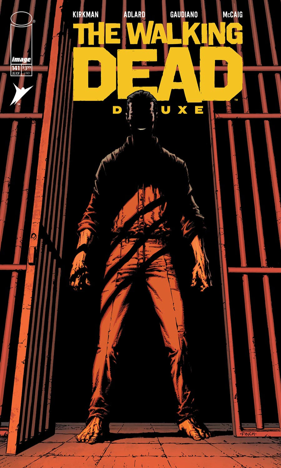 Comic book cover of 'The Walking Dead Deluxe' with a silhouette of a character in front of bars.