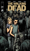 Comic book cover of 'The Walking Dead' with two characters in the center surrounded by zombies.